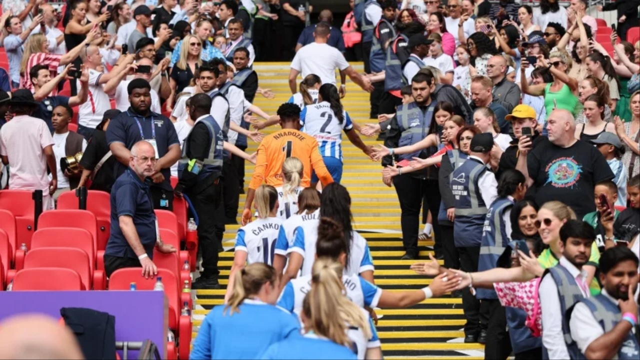 Brighton Women walking up Wembley stairs